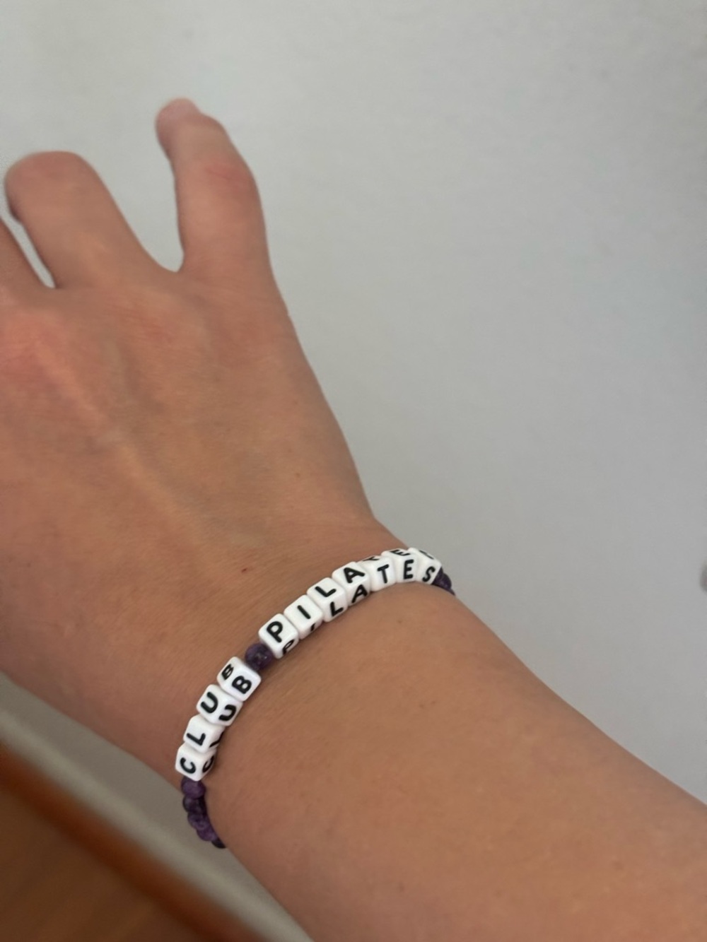 Purple Beaded Letter Bracelet with 'Club Pilates' Text